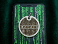 INMARK Digit pet tag on phone with Matrix code background