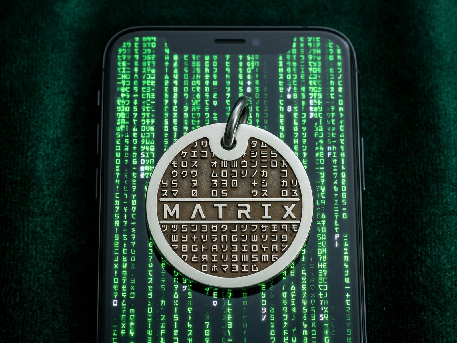 INMARK Digit pet tag on phone with Matrix code background